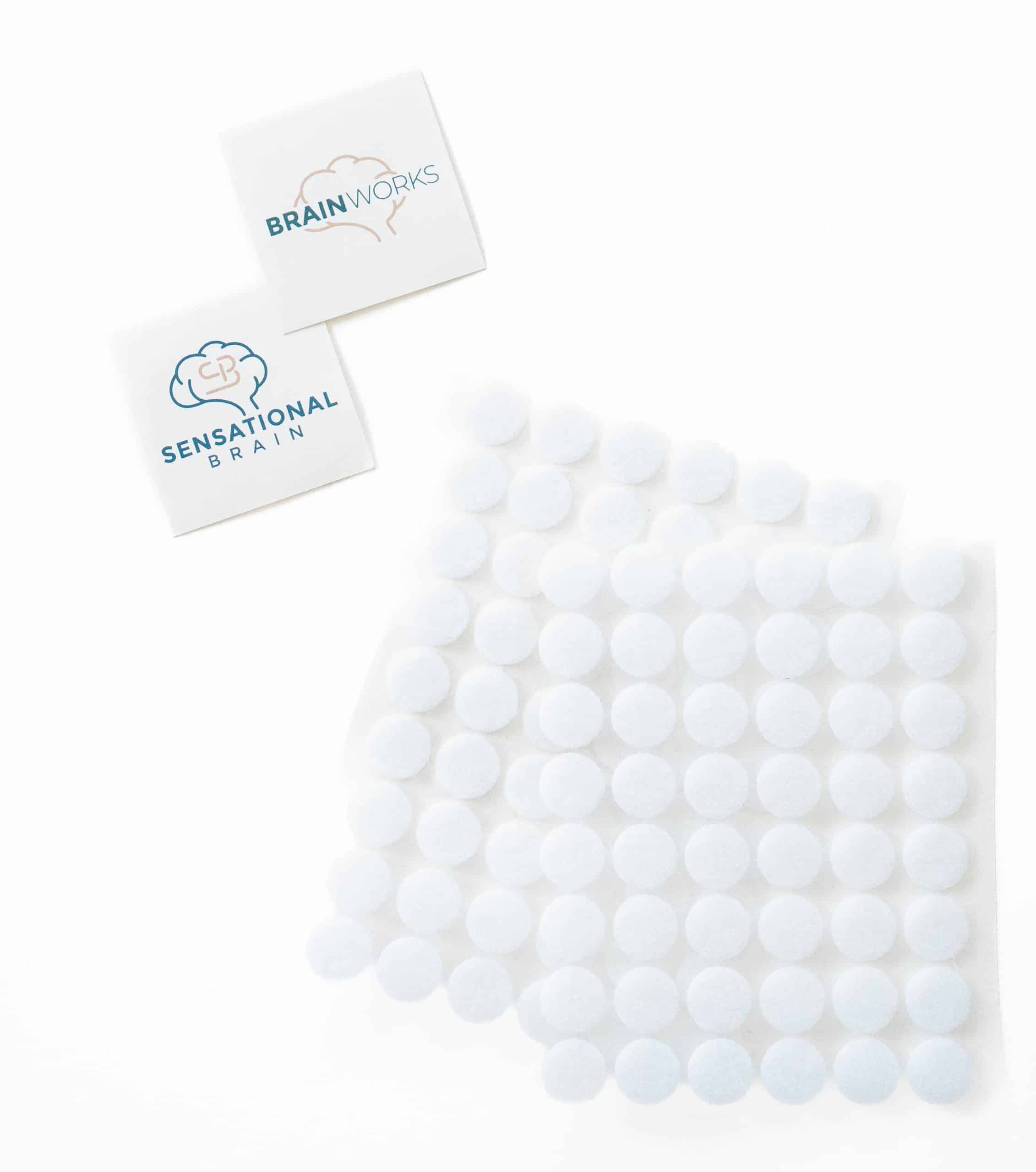 BrainWorks Single Printed Kit with logos and white adhesive dots on a white background.
