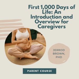 Pregnant woman sitting on the floor holding her abdomen in her hands