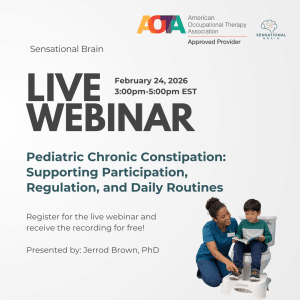 Therapist kneeling beside small child who is sitting on the lid of a toilet with his clothes on reading a book with a stool under his feet